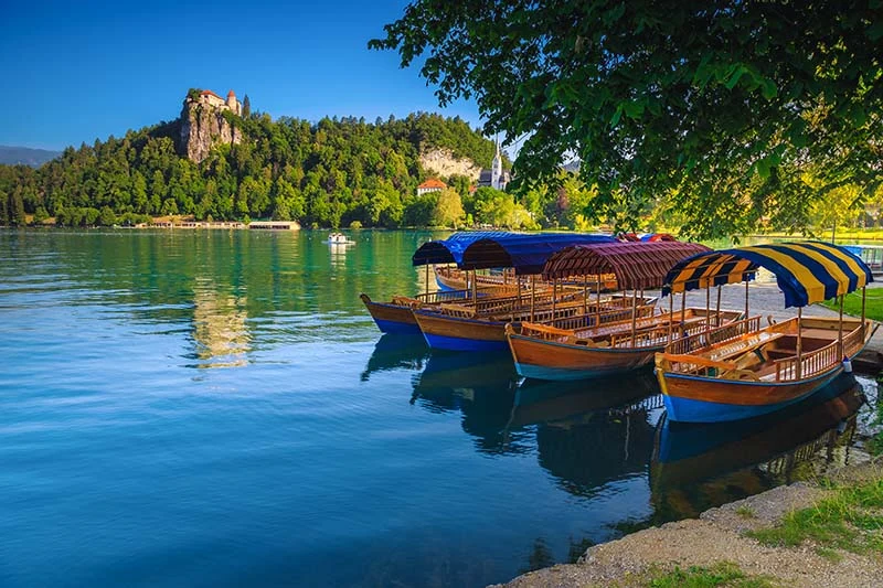 Lake Bled wooden boat trio 800 | Solo Travel For Women | Sisterhood Travels Group Tours