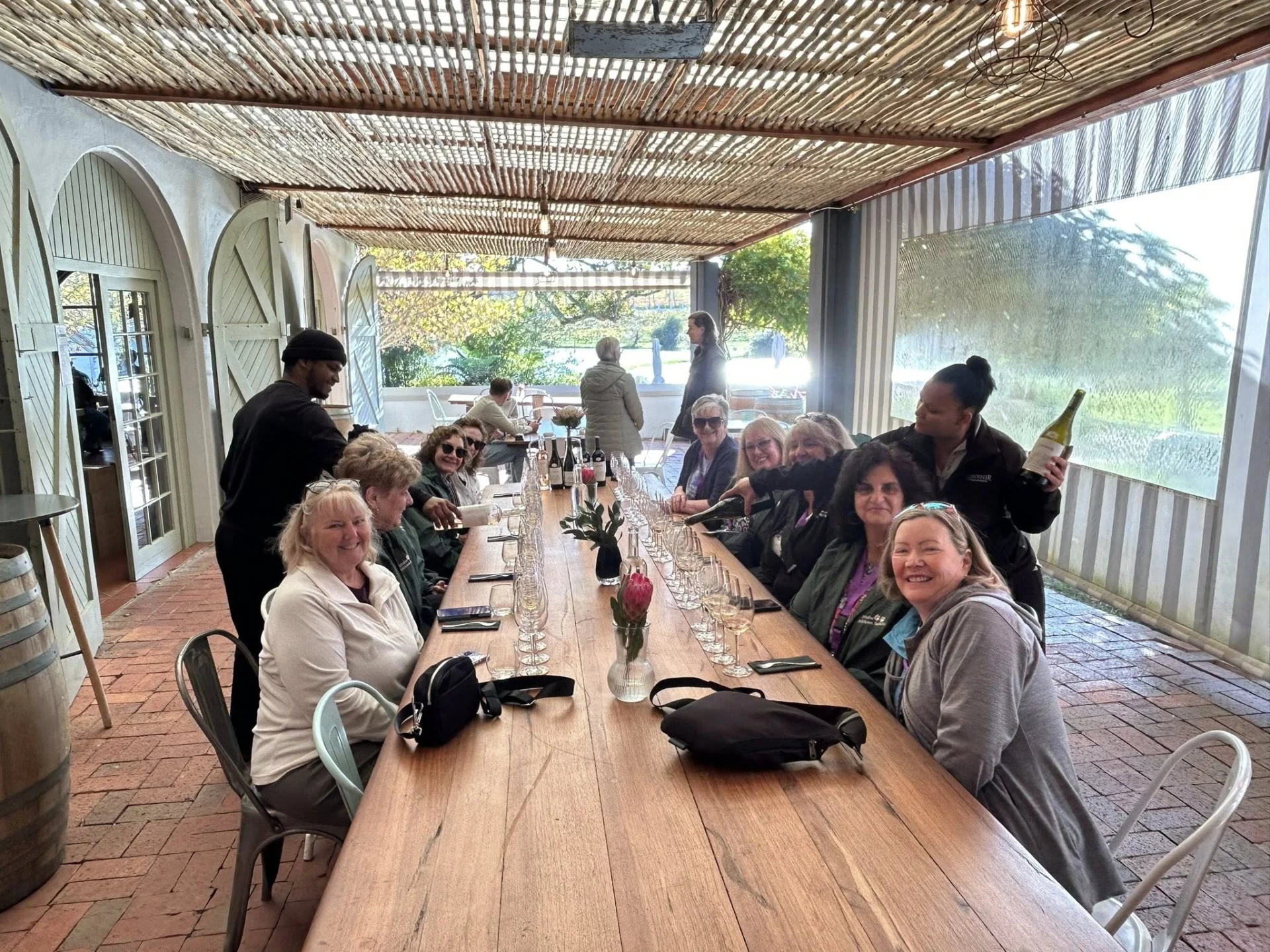 women at a table on a group tour