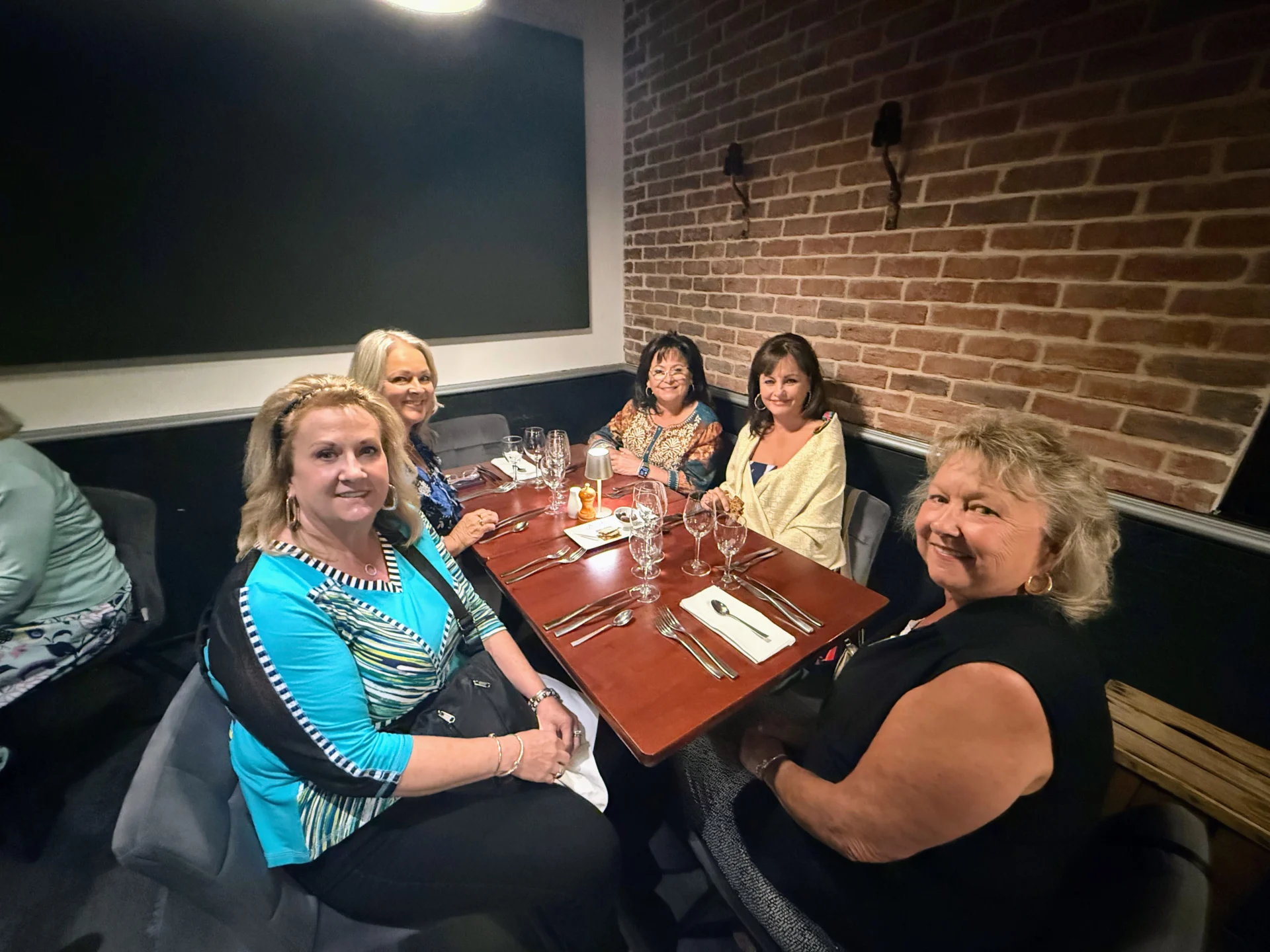 Why Travel Is Good For Seniors: The Health Benefits of Travel for Seniors 5 women having dinner