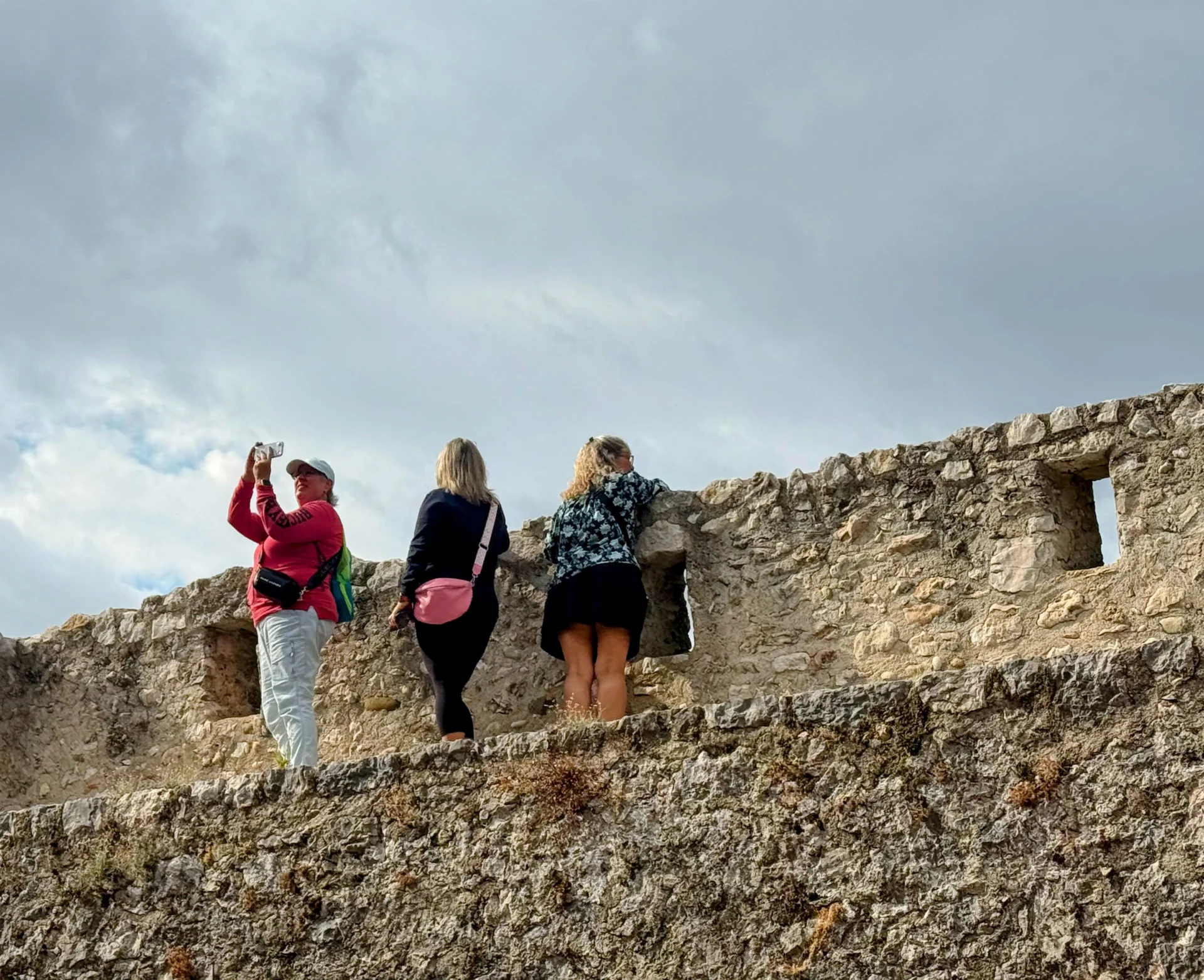 My Experience Traveling With Sisterhood Travels: What You Can Expect On Your First Trip 2 looking over the wall in St. Paul de Vence