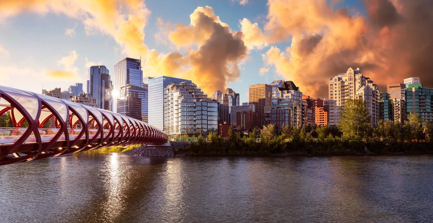 Canadian Rockies Luxury Rail Journey 2027 16 calgary canada sunset 1400 | Solo Travel For Women | Sisterhood Travels Group Tours