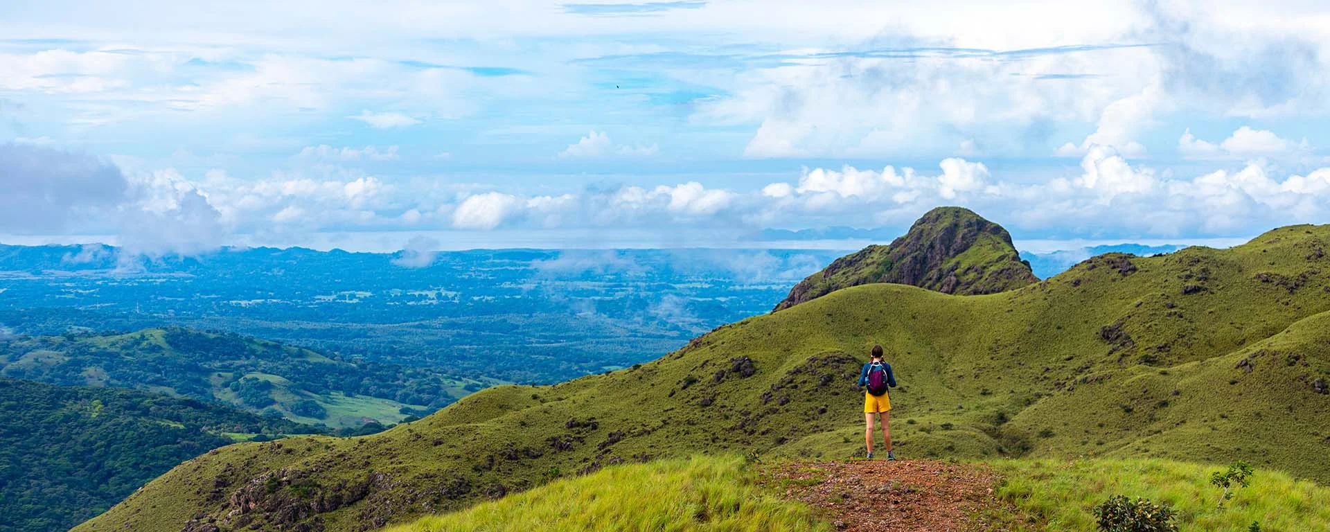 costa rica mountains girl with backpack