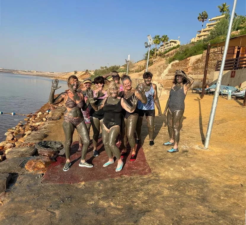 About us includes the sisters in Mud at the dead sea