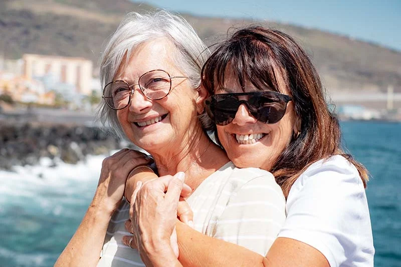 women hugging 800 | Solo Travel For Women | Sisterhood Travels Group Tours