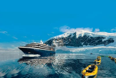 world-voyager-exterior-glacier-reflection-kayaks